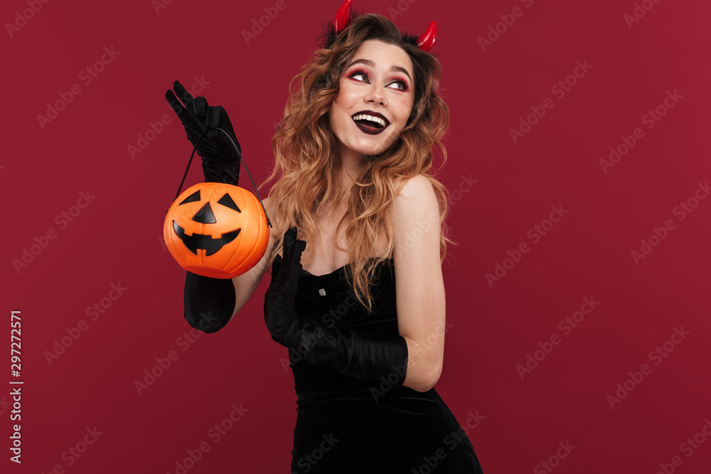 Smiling woman demon in carnival costume