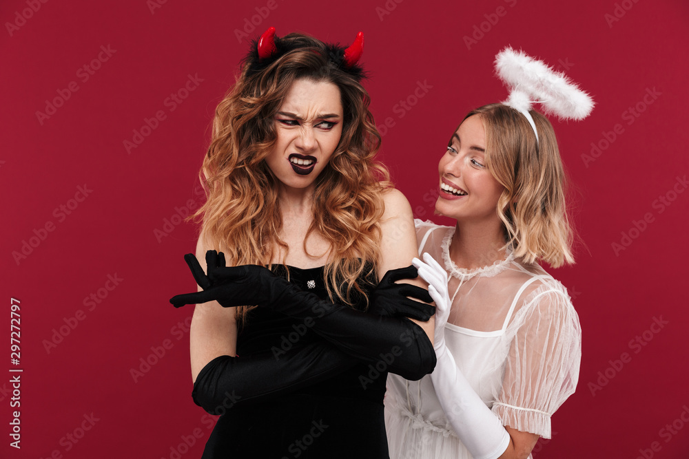 Displeased confused woman demon near positive angel Displeased confused woman demon near positive angel