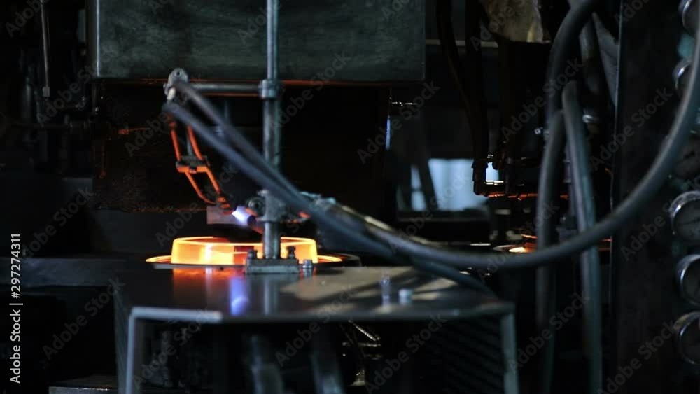Close - up Of the shape of insulators made of glass. Production of electric power insulators at the plant. Molten glass Close - up Of the shape of insulators made of glass. Production of electric power insulators at the plant. Molten glass