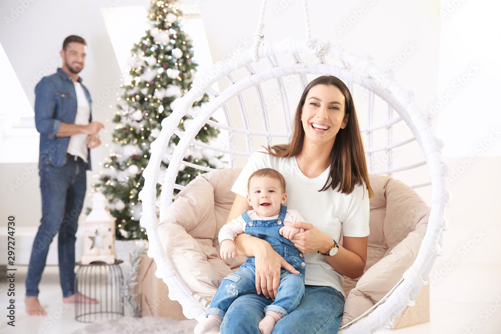 Young family relaxing at home during Christmas Young family relaxing at home during Christmas