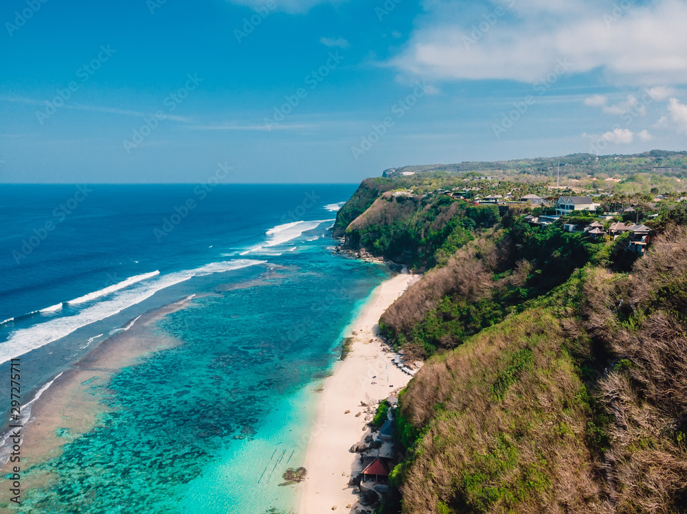Beautiful cliff and beach with ocean in Bali, aerial view