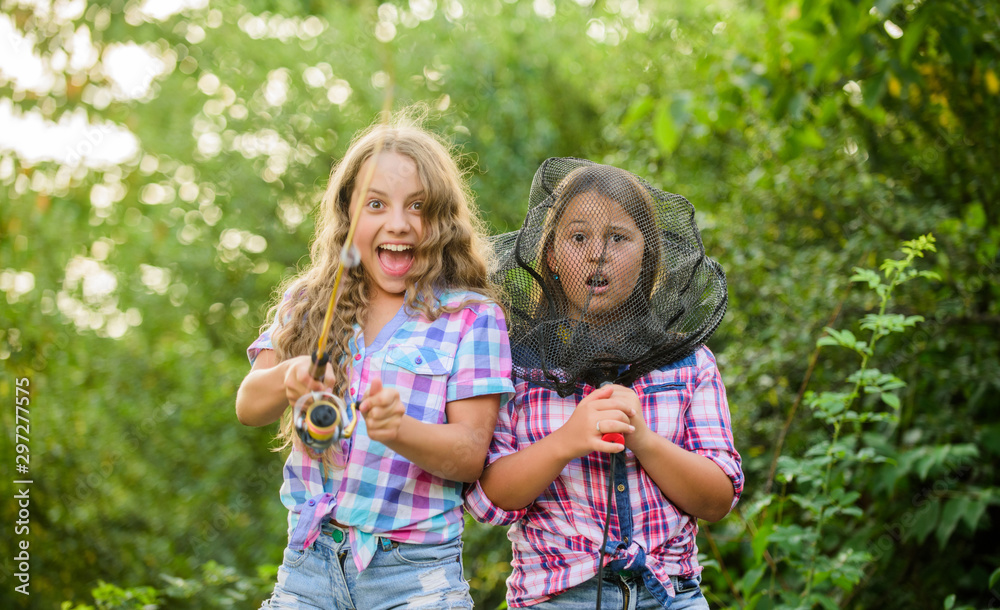 It is all about right angle. Fly Fishing. little kids spend time in camp. having fun. fish angler. girls fishing. Big game. summer hobby. happy children with net and rod. summer holidays weekend It is all about right angle. Fly Fishing. little kids spend time in camp. having fun. fish angler. girls fishing. Big game. summer hobby. happy children with net and rod. summer holidays weekend