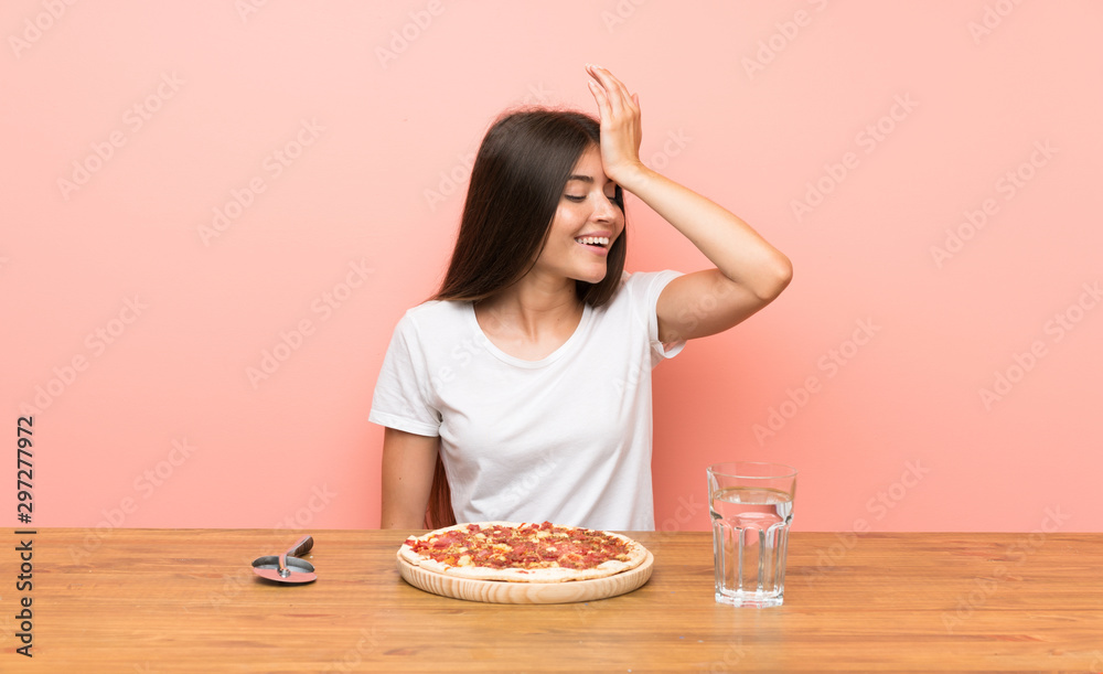 Young woman with a pizza has realized something and intending the solution