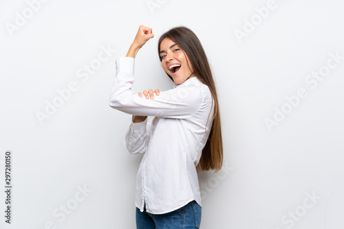 Young woman over isolated white background making strong gesture