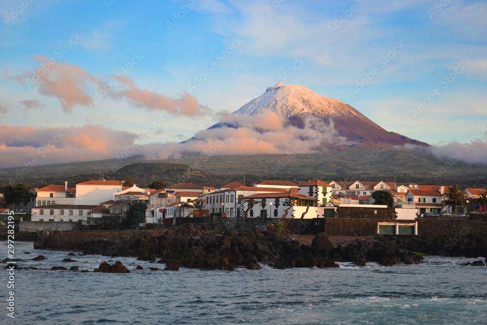 The highest mountain of Portugal, the Azores volcano Montanha do Pico on the island of Pico at sunset, village Madalena