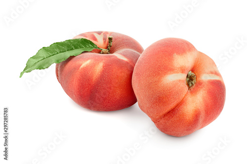 Ripe chinese flat peach fruit with leaf isolated on white background