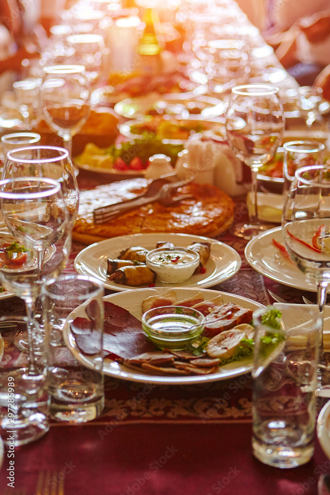 A blurred dining room for an Asian audience sits in a long line of table. A blurred dining room for an Asian audience sits in a long line of table.