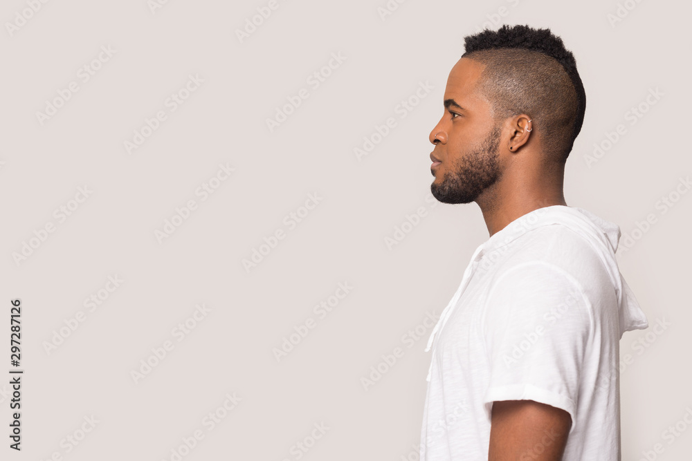 African American man in profile look at copy space African American man in profile look at copy space