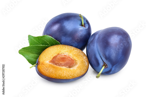 fresh blue plum and half with leaves isolated on white background