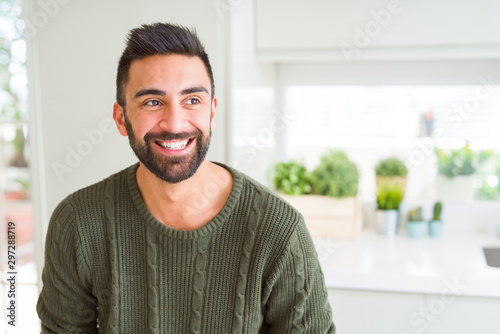 Handsome man smiling cheerful with a big smile on face showing teeth, positive and happy expression photo