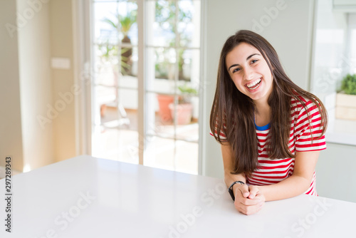 Beautiful young brunette woman smiling cheerful looking at the camera with a big smile on face showing teeth Free Download Beautiful young brunette woman smiling cheerful looking at the camera with a big smile on face showing teeth - GFXLoad