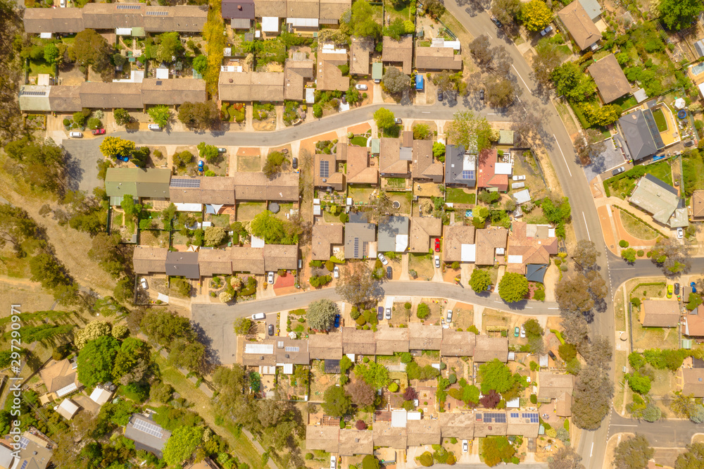 Aerial view of streets, cul-de-sacs, rooftops and parklands in the suburb of Latham in Canberra, the Capital of Australia     