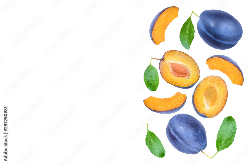 fresh blue plum and half with leaves isolated on white background. Top view. Flat lay fresh blue plum and half with leaves isolated on white background. Top view. Flat lay