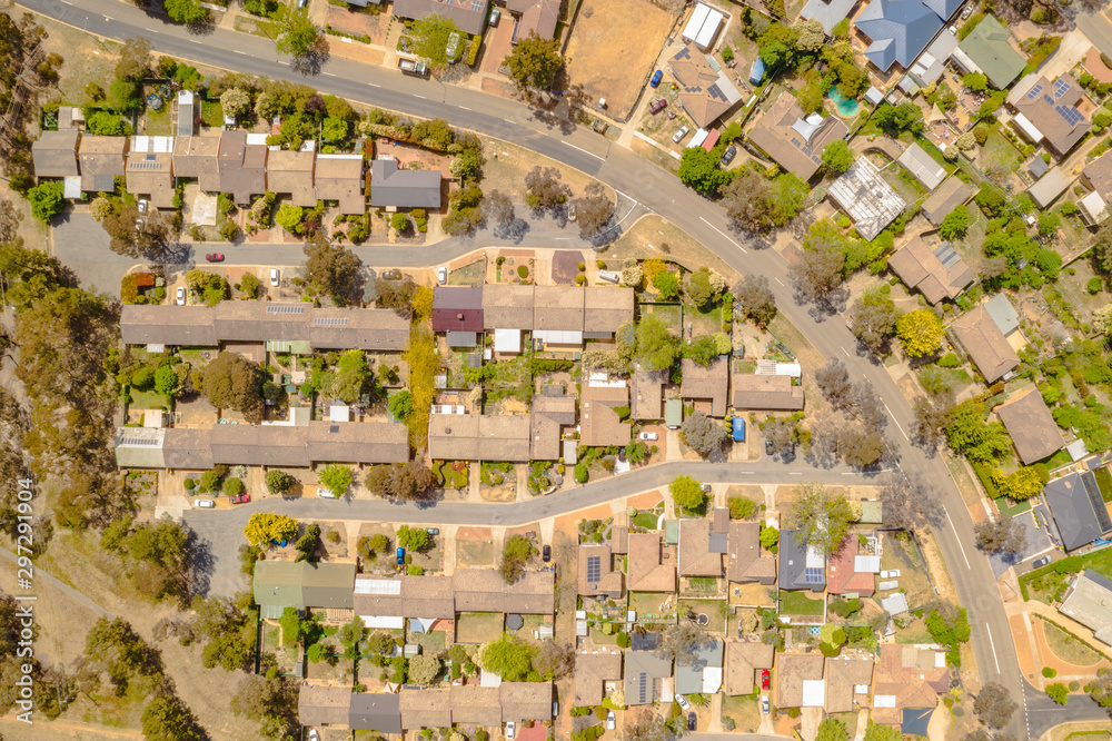 Aerial view of streets, cul-de-sacs, rooftops and parklands in the suburb of Latham in Canberra, the Capital of Australia     