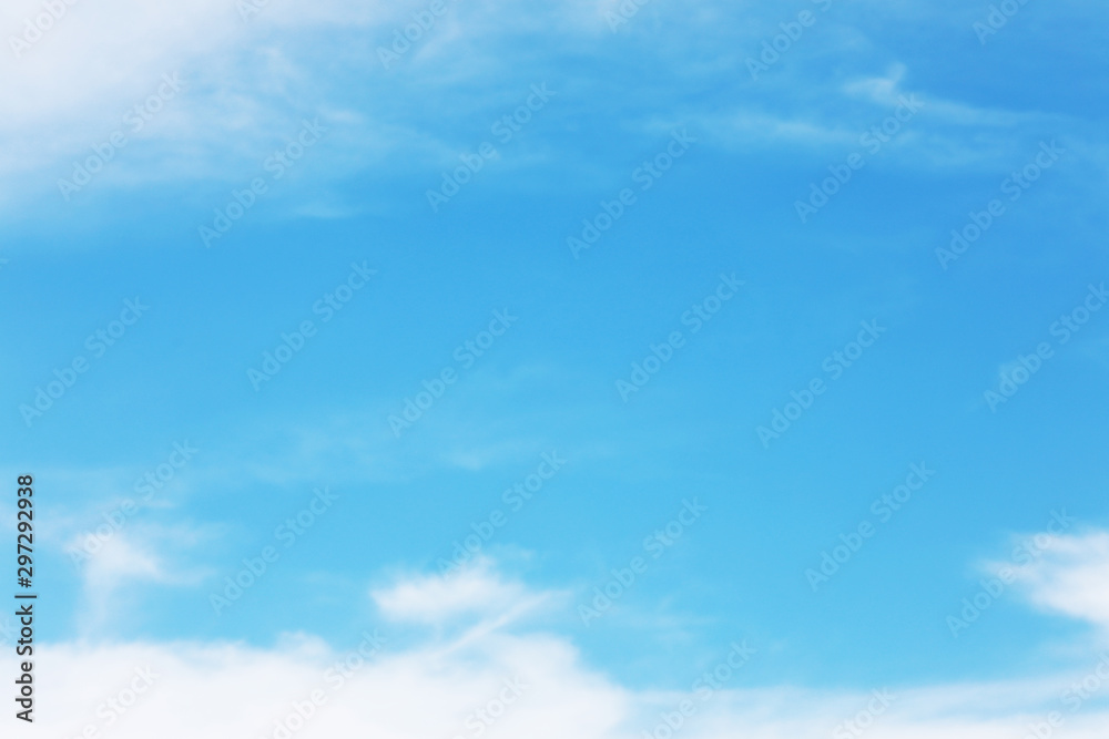 Blue sky background and white clouds soft focus, and copy space