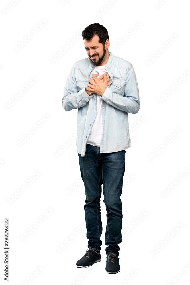 Full-length shot of Handsome man with beard having a pain in the heart over isolated white background Full-length shot of Handsome man with beard having a pain in the heart over isolated white background