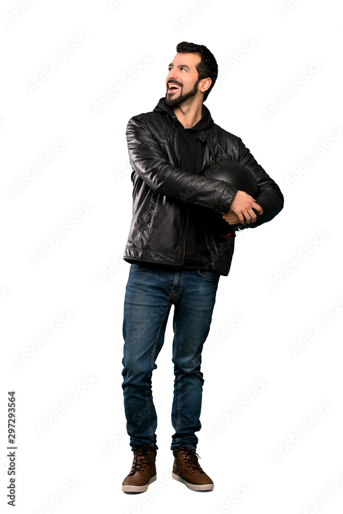 Full-length shot of Biker man happy and smiling over isolated white background Full-length shot of Biker man happy and smiling over isolated white background