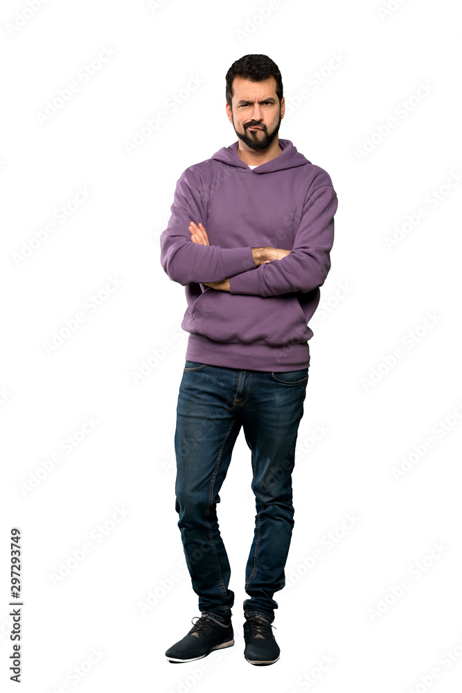 Full-length shot of Handsome man with sweatshirt feeling upset over isolated white background Full-length shot of Handsome man with sweatshirt feeling upset over isolated white background