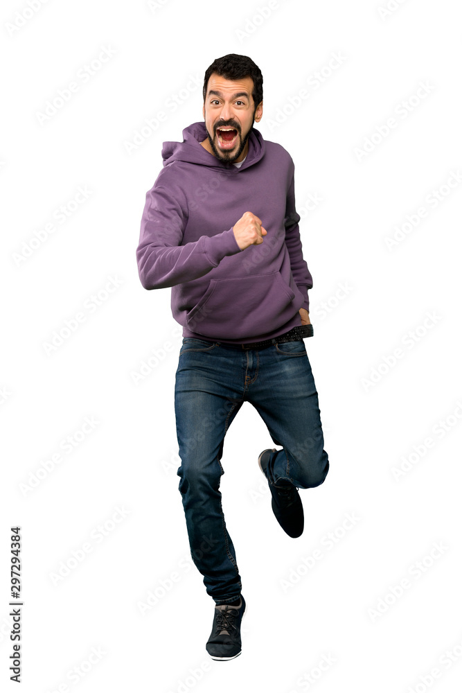 Handsome man with sweatshirt running fast Handsome man with sweatshirt running fast
