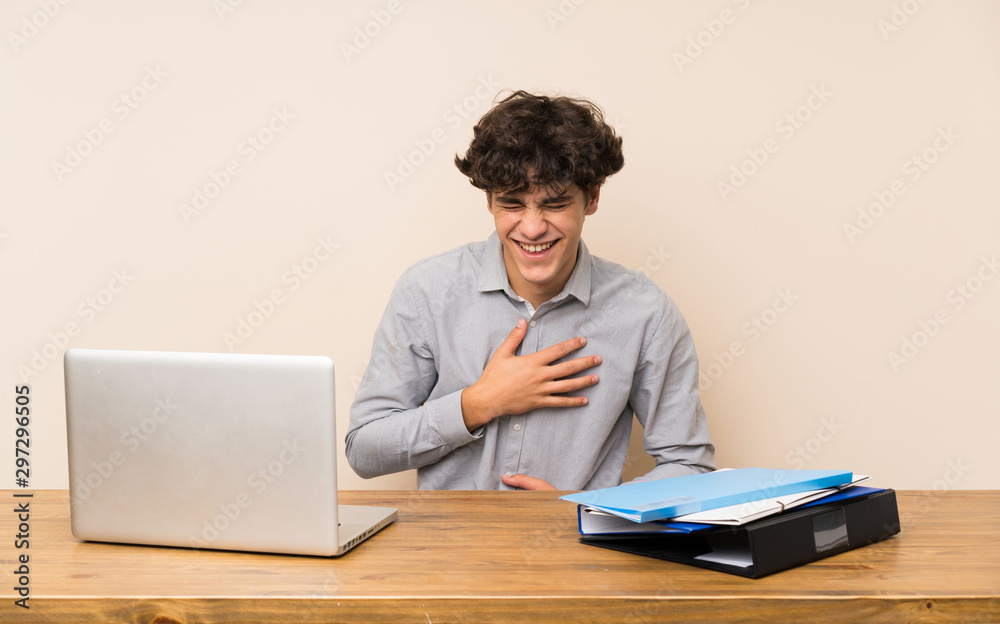 Young student man with a laptop smiling a lot Young student man with a laptop smiling a lot