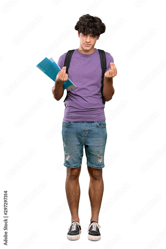 A full-length shot of a Young student man making money gesture over isolated white background