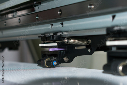 Close detail of clamping piece of a vinyl printing plotter