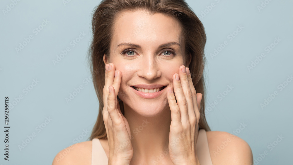 Smiling millennial woman touch healthy breathing skin Smiling millennial woman touch healthy breathing skin