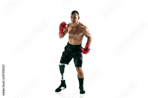 Full length portrait of muscular sportsman with prosthetic leg, copy space. Male boxer in red gloves. Isolated shot on white studio background. © master1305