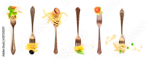 Italian food collage. Pasta design elements. Many forks with pasta and various addings  shot from above on a white background