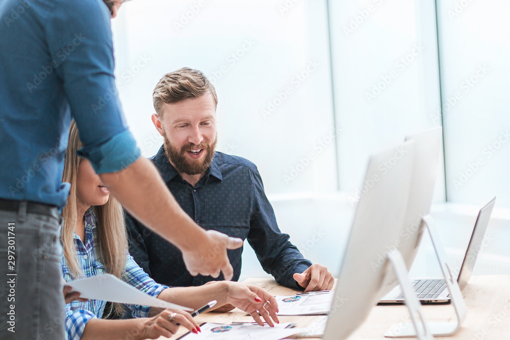 business team discussing working documents in a light office. business team discussing working documents in a light office.
