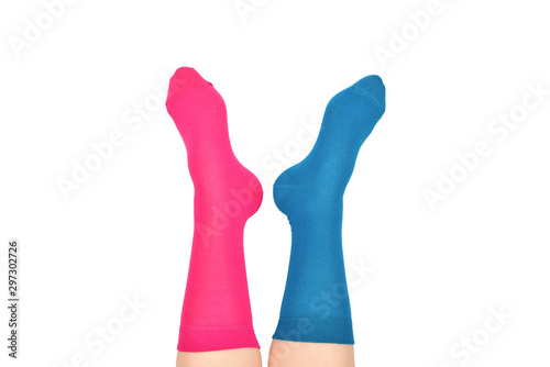 Woman in blue and purple socks isolated on white background. Top view.