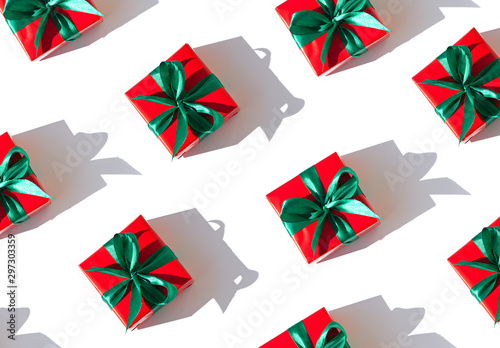 Christmas seamless pattern with gift boxes on theChristmas seamless pattern with gift boxes on thChristmas seamless pattern with gie bright white background. Top view bright white background. Top view photo