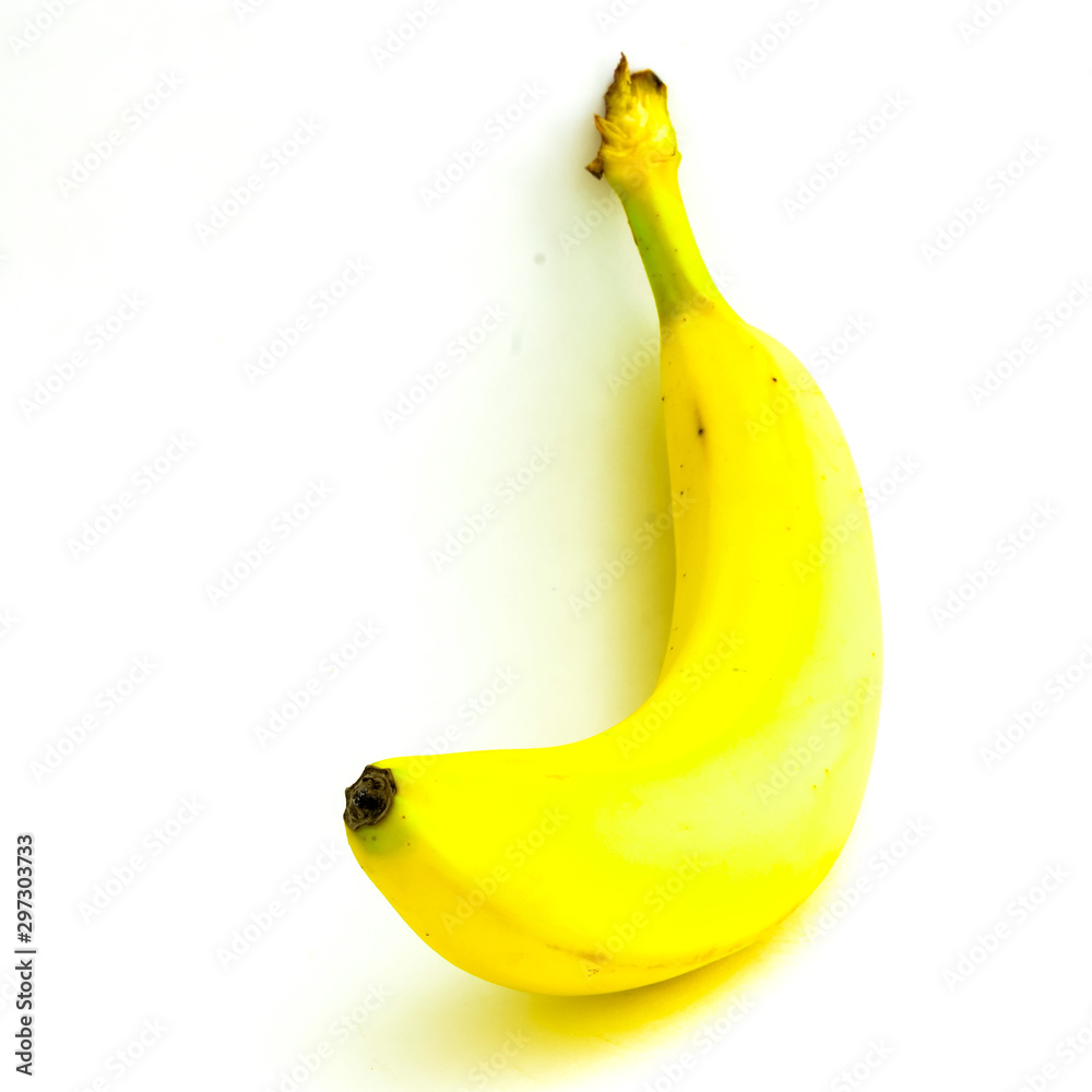 Studio shot single organic whole banana isolated on white