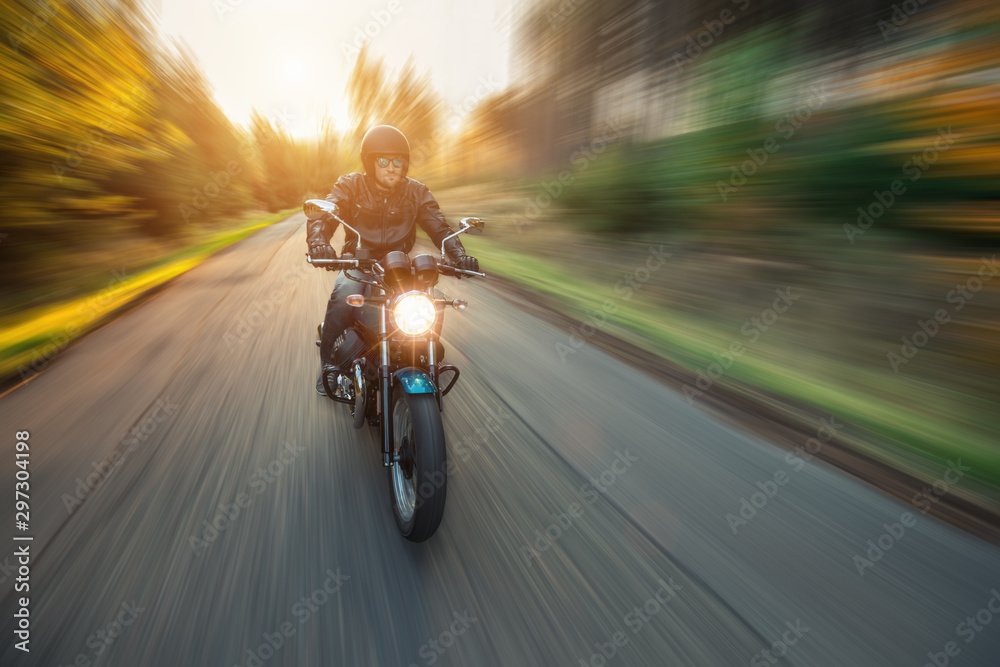 Motorcycle driver with blurred motion effect - obrazy, fototapety, plakaty 