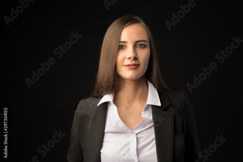 young beautiful brunette girl black background, portrait, straight long dark hair, black jacket, white blouse
