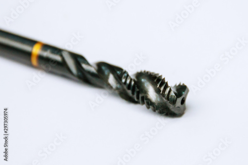 Tap for threading in metal. Tool for metal processing.