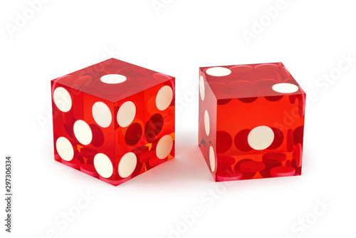Two red professional game dice closeup isolated on a white background / one and two with a light shadow.
