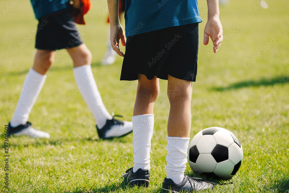 School Kids Training Football on Pitch  Group of Young School Age Boys On Training Session With Youth Coach. Kids in Blue Jersey Schools & Sports Kit on Soccer Venue. Summer Soccer Season