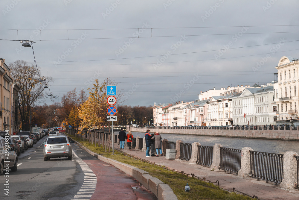 river embankment in St. Petersburg, October 2019, old buildings, people on the street,