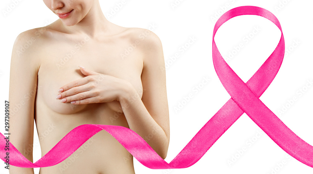 Young redhead woman cover her breast near big pink ribbon. Young redhead woman cover her breast near big pink ribbon.
