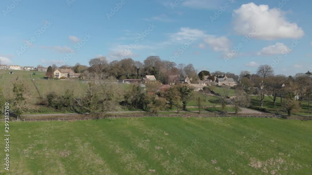 Cotswold Stone Houses Edge Of Village Spring Stow-On-The-Wold Blue Cloudy Sky Aerial 4K Cine D Cotswold Stone Houses Edge Of Village Spring Stow-On-The-Wold Blue Cloudy Sky Aerial 4K Cine D