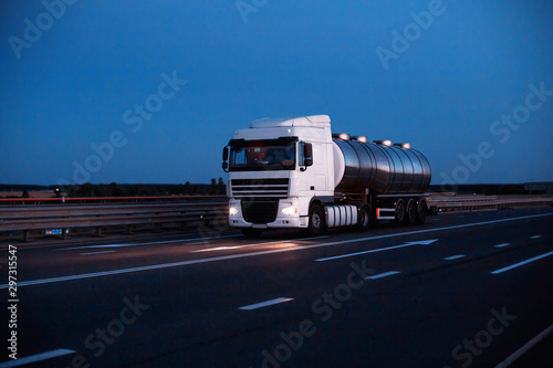 A truck driver is transporting dangerous goods in a tank. The concept of transportation of dangerous goods ADR truckers, copy space