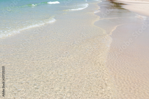Blue sea waves summer background. Sand beach