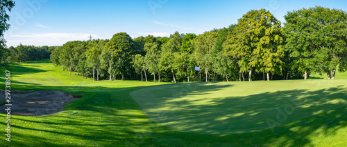 Panorama View of Golf Course with beautiful putting green. Golf course with a rich green turf beautiful scenery.