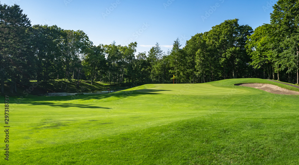 Golf Course with beautiful green field. Golf course with a rich green turf beautiful scenery.