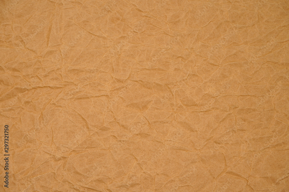 Brown crumpled packaging paper background texture. Kraft Paper Coarse. Wrinkled paper bag Brown crumpled packaging paper background texture. Kraft Paper Coarse. Wrinkled paper bag