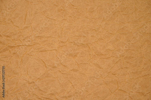 Brown crumpled packaging paper background texture. Kraft Paper Coarse. Wrinkled paper bag