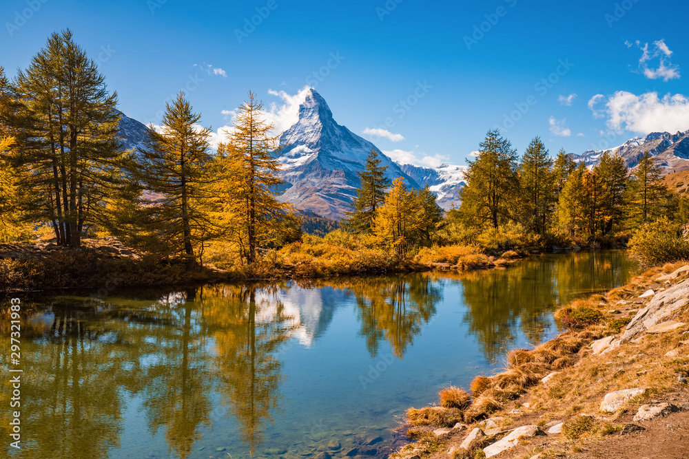 Great autumn panorama with famous peak Matterhorn reflected in Grinjisee lake. Swiss Alps, Valais, Switzerland
