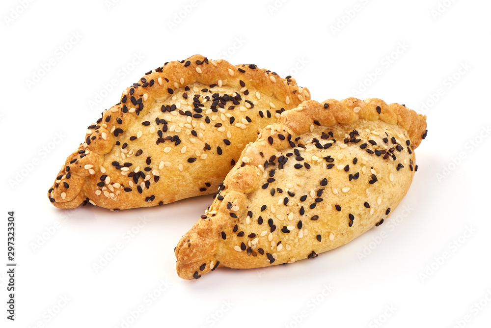 Freshly baked patties with sesame seeds, isolated on white background Freshly baked patties with sesame seeds, isolated on white background