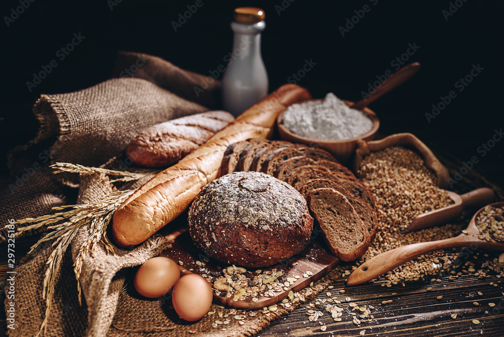 Whole wheat bread and home cooking ingredients that are healthy and nutritious. - obrazy, fototapety, plakaty 